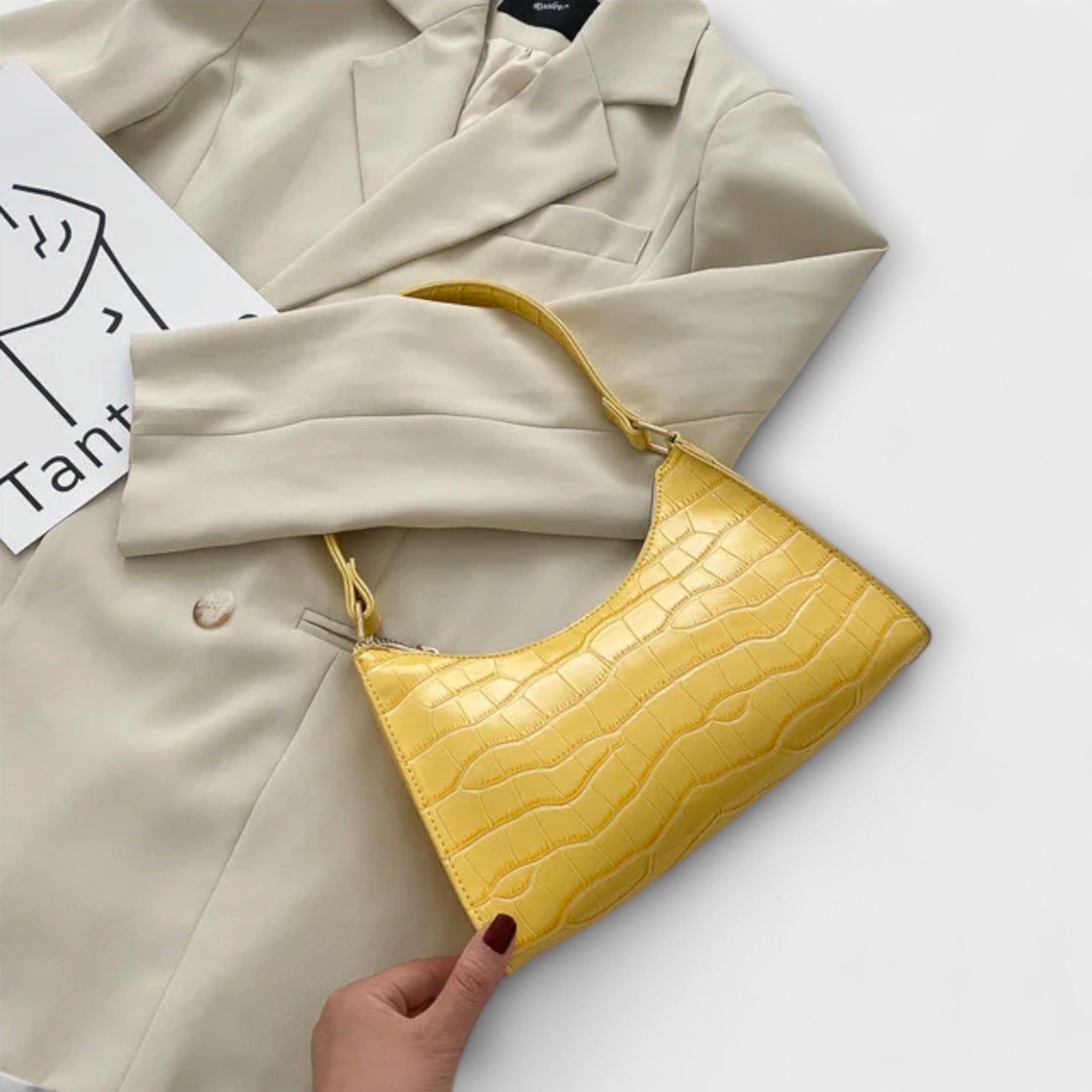 Kiiltävä nahkalaukku